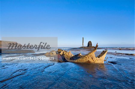 Admiral Von Tromp's wreck and Black Nab at low tide in Saltwick Bay, Yorkshire, England, United Kingdom, Europe