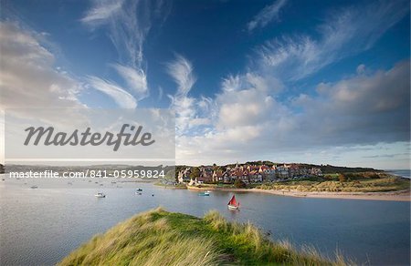 Alnmouth village and the Aln Estuary viewed from Church Hill on a calm late summer's evening with a dramatic sky overhead, Alnmouth near Alnwick, Northumberland, England, United Kingdom, Europe