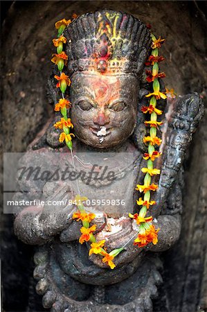 Small shrine with blessing of colourful paint and offerings of food, Swayambhunath (The Monkey Temple), Kathmandu, Nepal, Asia