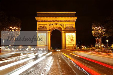 Arc de Triomphe and Champs Elysees at night, Paris, France, Europe
