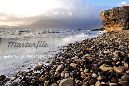 Waves breaking on the rocky foreshore at Elgol, Isle of Skye, Inner Hebrides, Scotland, United Kingdom, Europe