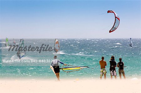 Spectators watching windsurfing in high Levante winds in the Strait of Gibraltar, Valdevaqueros, Tarifa, Andalucia, Spain, Europe