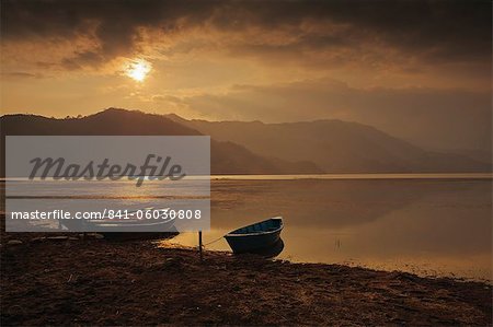 Local fishing boats on Phewa Lake at sunset, Gandak, Nepal, Asia