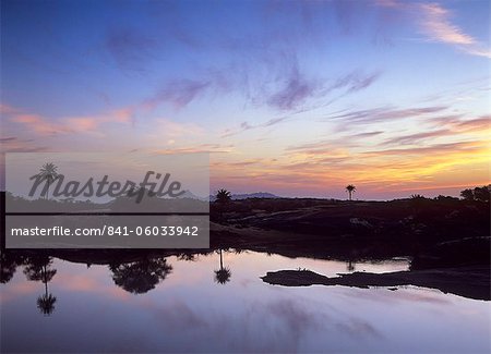 Sunrise over the lake at Fort Seengh Sagar in Rajasthan, India, Asia