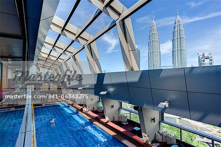 View from a rooftop pool and skybar of the iconic 88 Petronas Towers, Kuala Lumpur, Malaysia, Southeast Asia, Asia