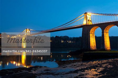Menai Bridge illuminated at dusk, Gwynedd, Anglesey, North Wales, Wales, United Kingdom, Europe
