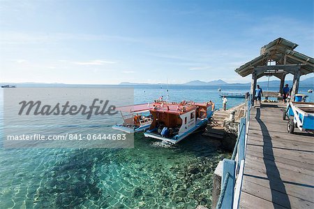 Dive boats at Gangga Island jetty, Sulawesi, Indonesia, Southeast Asia, Asia