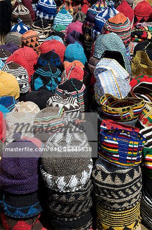 Brightly coloured knitted wool hats for sale in the souk in Marrakech, Morocco, North Africa, Africa