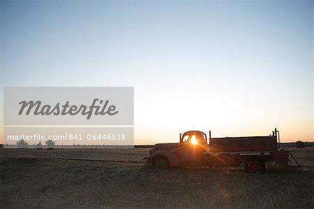 The sun beams through window of old farm truck at sunrise, Shaniko, California, United States of America, North America