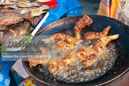 Pollo Campero (fried chicken) in the market at Santiago Sacatepequez, Guatemala, Central America