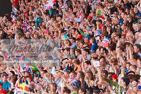 Large crowd of British spectators with Union flags in a sports arena, London, England, United Kingdom, Europe