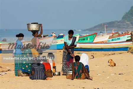 Local women buying freshly caught fish, Chowara Beach, near Kovalam, Kerala, India, Asia