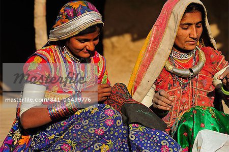 Mir tribal women with traditional attire doing embroidery work, Gujarat, India, Asia