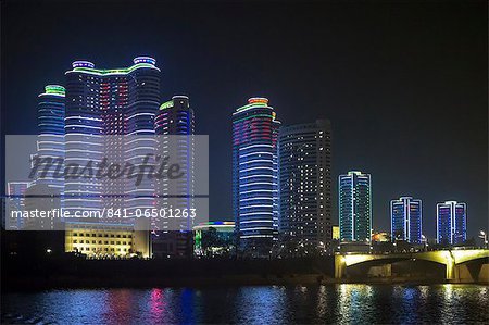 Modern city apartments illuminated at night, Pyongyang, Democratic People's Republic of Korea (DPRK), North Korea, Asia