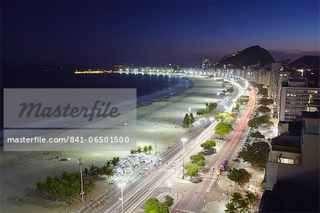 View of Copacabana beach and Avenida Atlantica at dusk, Copacabana, Rio de Janeiro, Brazil, South America