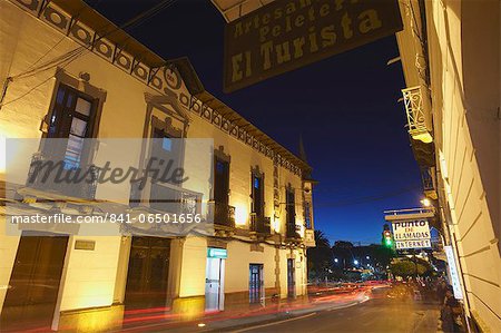 Traffic passing along street at dusk, Sucre, UNESCO World Heritage Site, Bolivia, South America