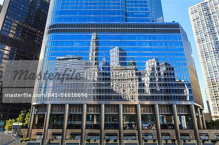 Skyscrapers on West Wacker Drive reflected in the Trump Tower, Chicago, Illinois, United States of America, North America