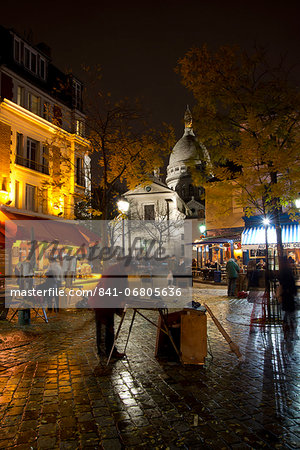 The Sacre Coeur and Montmartre on a rainy night, Paris, France, Europe