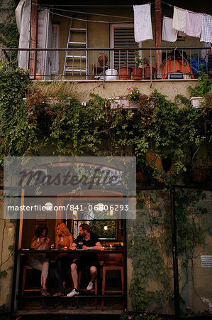 People sitting at a bar in the trendy Neve Tzedek neighbourhood, Tel Aviv, Israel, Middle East