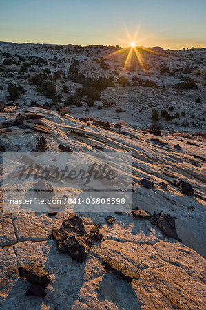 Sunrise above Navajo sandstone and lava chunks, Grand Staircase-Escalante National Monument, Utah, United States of America, North America