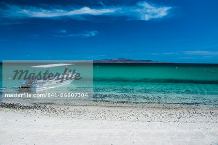 Boat on Playa Tecolote with Isla Espiritu Santo in the background, Baja California, Mexico, North America