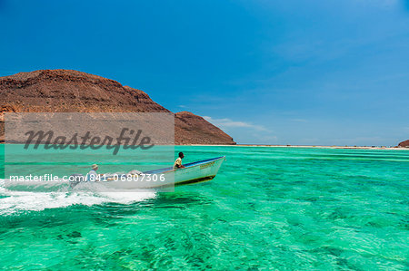 Little boat in the turquoise waters at Isla Espiritu Santo, Baja California, Mexico, North America