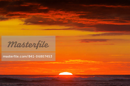 Sunset & sunlit clouds over Playa Guiones surf beach, Nosara, Nicoya Peninsula, Guanacaste Province, Costa Rica, Central America