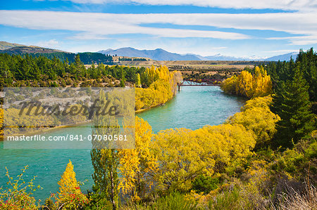 Caravan crossing a bridge on the Clutha River in autumn, Wanaka, South Island, New Zealand, Pacific