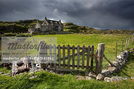 Abandoned croft beneath a stormy sky in the township of Manish on the east coast of The Isle of Harris, Outer Hebrides, Scotland