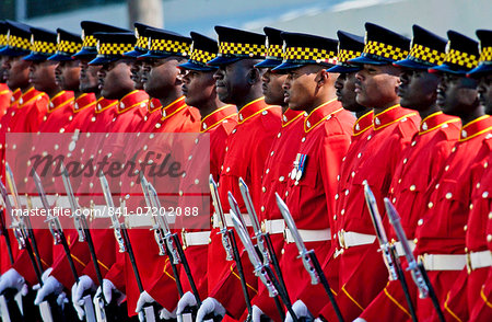 A Guard of Honour, dressed in bright red jackets at Parliament in Kingston, Jamaica