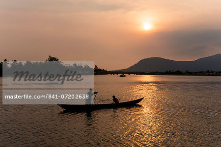 Father and son fishing on Kampong Bay River at sunset, Kampot, Cambodia, Indochina, Southeast Asia, Asia