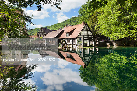 Mill reflecting in Blautopf Spring, Blaubeuren, Swabian Alb, Baden Wurttemberg, Germany, Europe