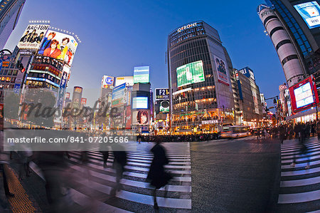 Shibuya Crossing, crowds of people crossing the intersection in the centre of Shibuya, Tokyo, Honshu, Japan, Asia