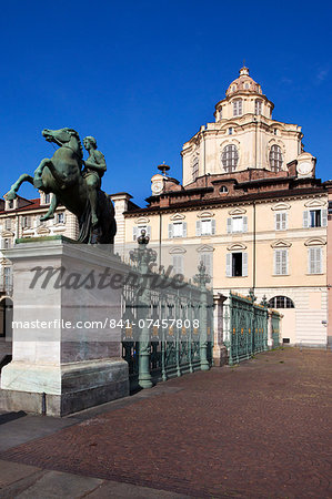 Statue and railings in Piazza Reale with San Lorenzo Church, Turin, Piedmont, Italy, Europe