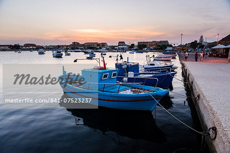 Fishing boats at sunset in Marzamemi fishing harbour, South East Sicily, Italy, Mediterranean, Europe