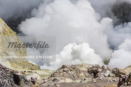 Visitors to an active andesite stratovolcano on White Island, off the East side of North Island, New Zealand, Pacific