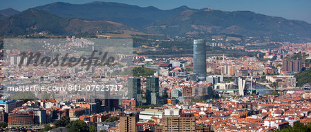 Aerial view of Bilbao Guggenheim Museum, Iberdrola Tower skyscraper and Red Bridge in Basque country, Spain