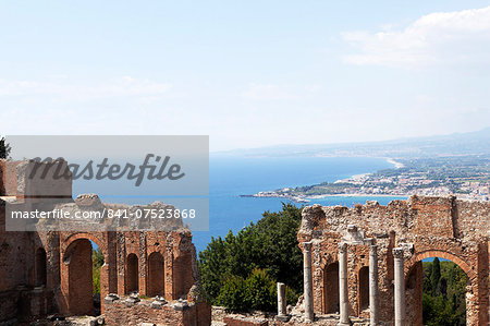 View over the Naxos coast from the Greek Roman theatre of Taormina, Sicily, Italy, Europe
