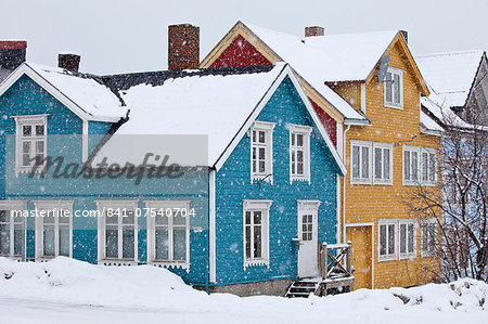Traditional architecture wooden buildings along Storgata in the quaint area of the city of Tromso, in the Arctic Circle in Northern Norway