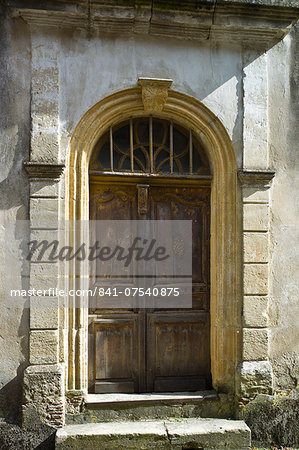 Traditional French doorway in quaint town of Castelmoron d'Albret in Bordeaux region, Gironde, France