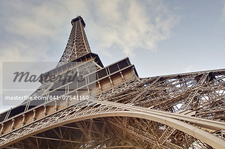 The Eiffel Tower towers overhead, Paris, France, Europe The Eiffel Tower towers overhead, Paris, France, Europe