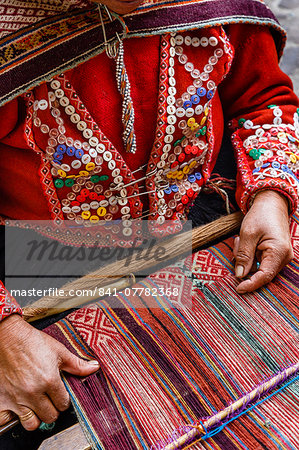 Quechua woman weaving a traditional textile, Cuzco, Peru, South America