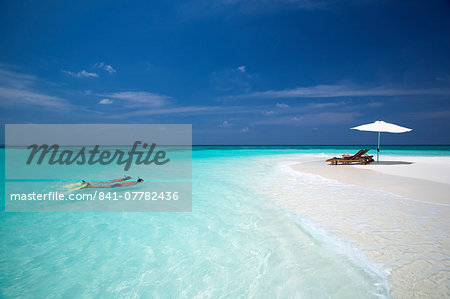 Couple snorkelling in Maldives, Indian Ocean, Asia Couple snorkelling in Maldives, Indian Ocean, Asia