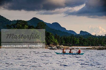 Outrigger cruising on the waters near the Puerto Princesa underground river, Palawan, Philippines, Southeast Asia, Asia