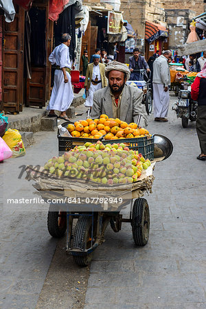 Man selling fruit in the Old Town, UNESCO World Heritage Site, Sanaa, Yemen, Middle East