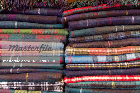 Traditional checks, plaid and Highland clan tartan lambswool throws and textiles on display for sale at Lochcarron Weavers at Lochcarron in the Highlands of Scotland, United Kingdom, Europe