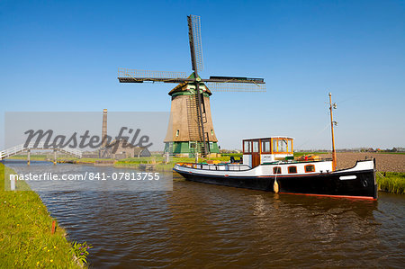 Traditional Windmill beside a Canal, near Obdam, North Holland, Netherlands, Europe