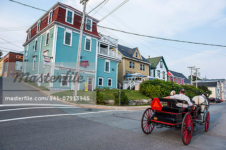 Horse cart riding historical style in the Old Town, Lunenburg, UNESCO World Heritage Site, Nova Scotia, Canada, North America