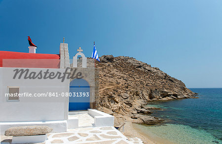 A red domed seafront church on Mykonos, The Cyclades, Geek Islands, Greece, Europe