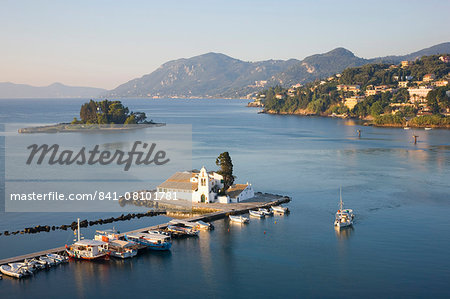 View to the Monastery of Panagia Vlacherna, small boat approaching, Kanoni, Corfu Town, Corfu, Ionian Islands, Greek Islands, Greece, Europe
